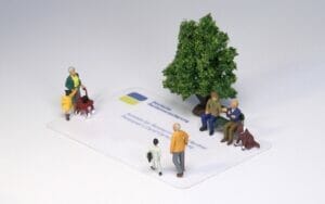 German Pension Identification Card with Tiny Human Figures - Understanding the German Pension System