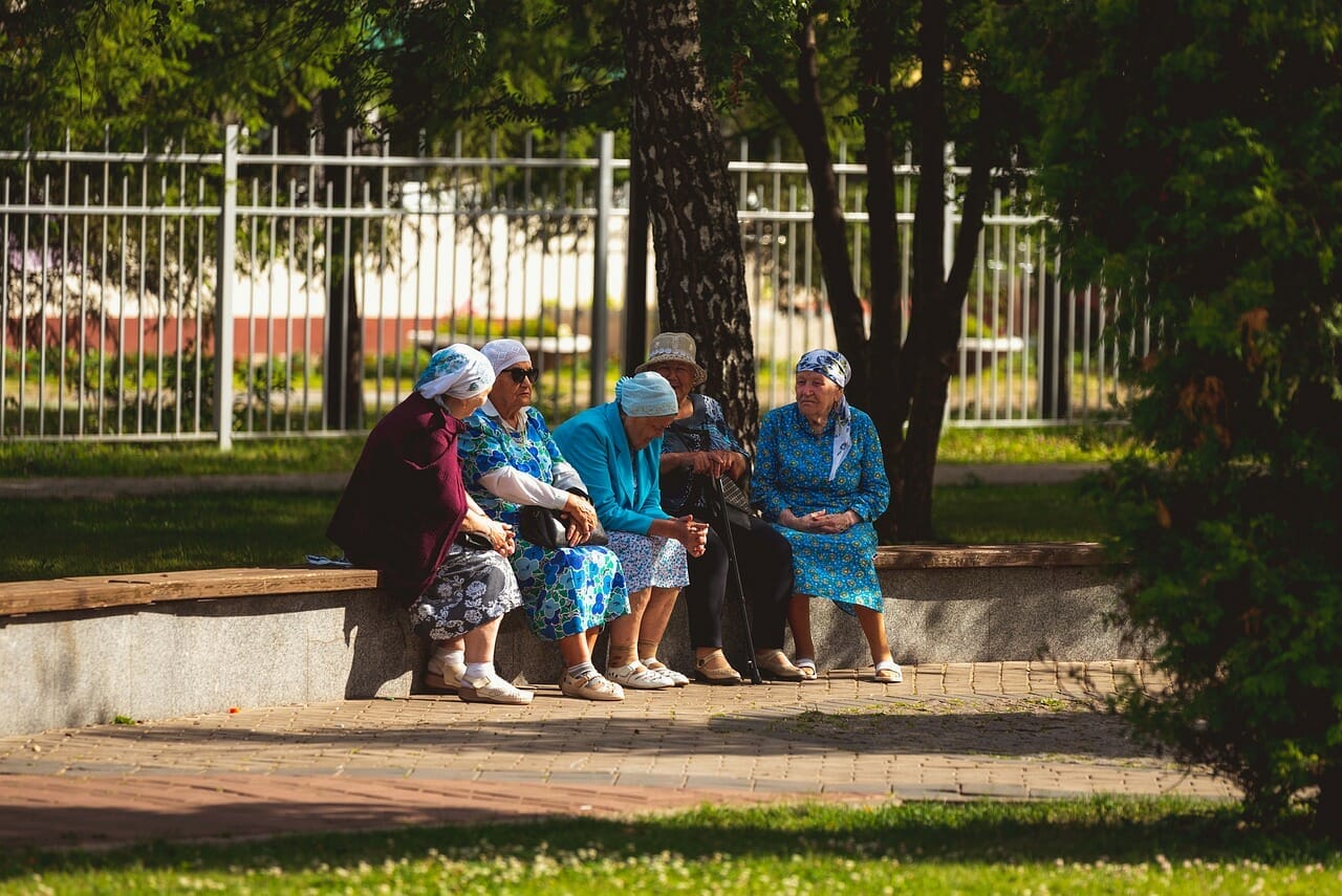 Elderly Ladies Conversing in Park - Understanding German Pension Scheme for Retirement Planning